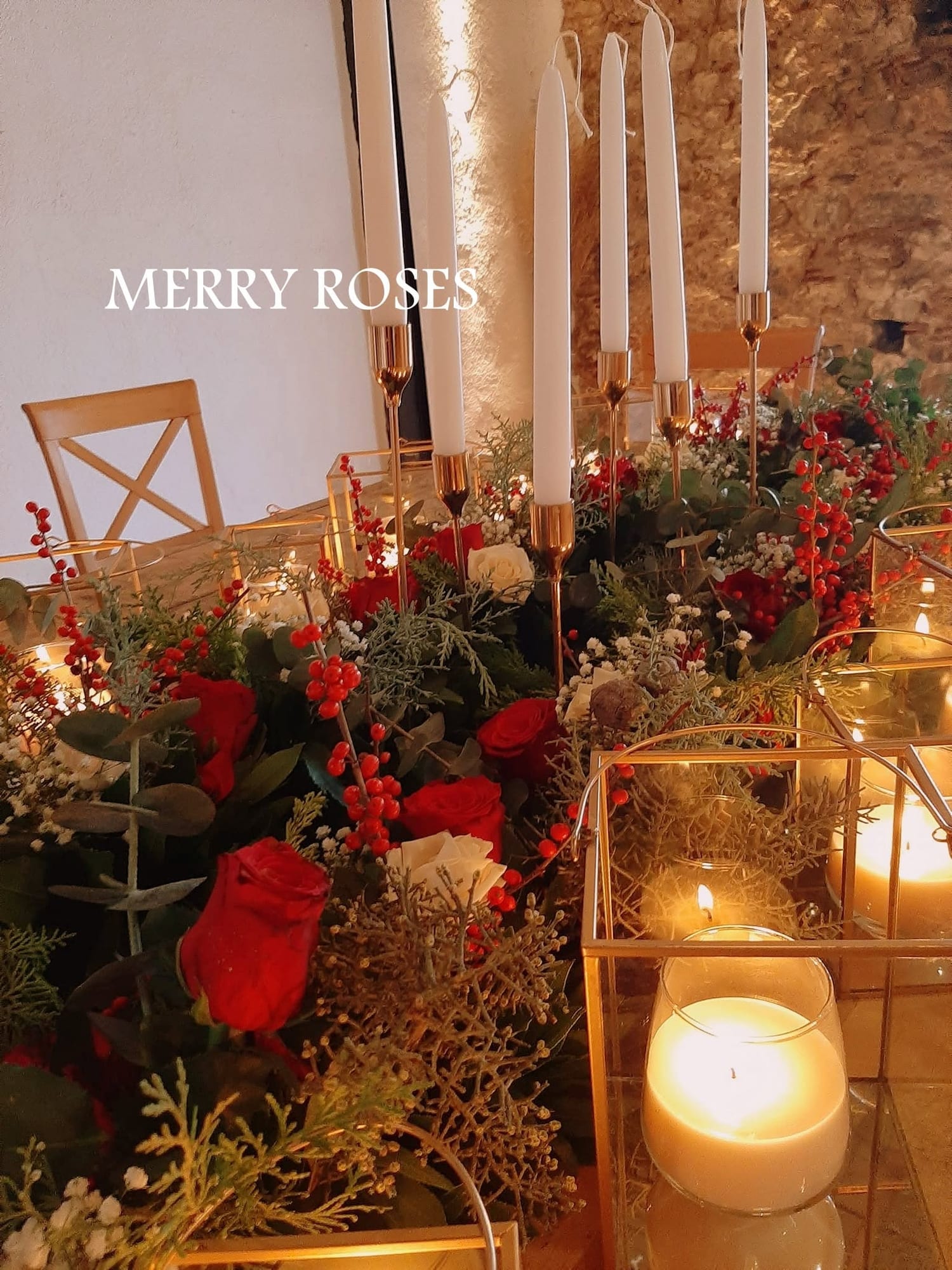 The table detail with the reds and the candles
